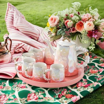 Moderno set di tazze di tè in ceramica rosa di lusso con disegno di conchiglia e piatto per il tè pomeridiano